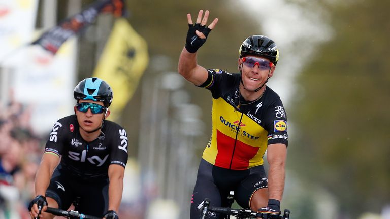 Belgium cyclist Philippe Gilbert of team Quick Step Floors (R) celebrates next to Polish cyclist  after winning for the forth time the Amstel Gold Race cla