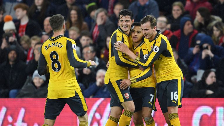 Alexis Sanchez celebrates Arsenal's first goal with Granit Xhaka and Rob Holding