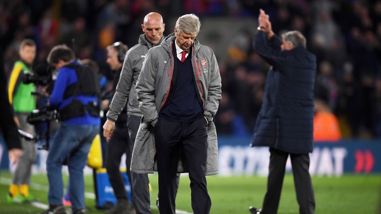 Arsene Wenger leaves the pitch after Arsenal's 3-0 defeat to Crystal Palace