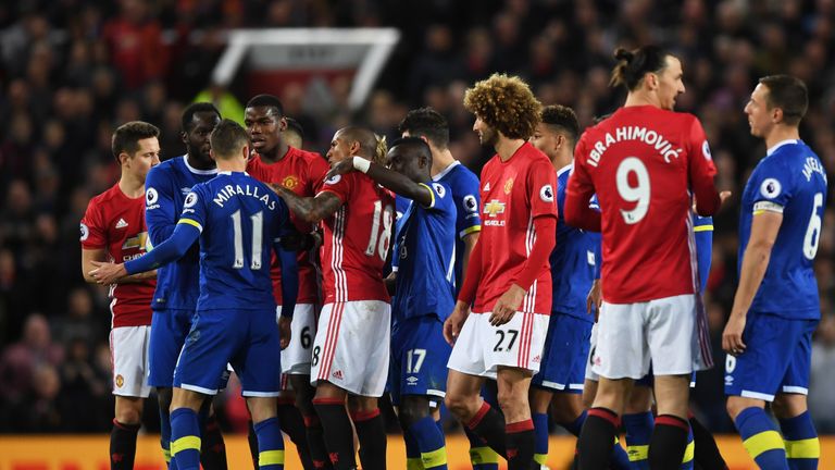 The Everton and Manchester United players clash during the Premier League match between Manchester United and Everton at Old Trafford