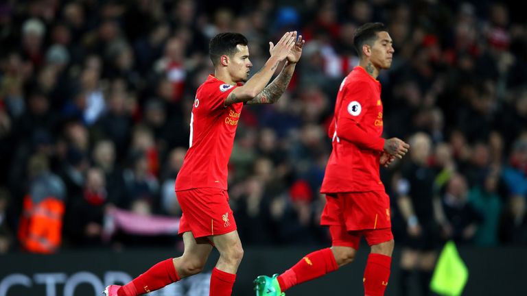 Philippe Coutinho celebrates after scoring Liverpool's equaliser