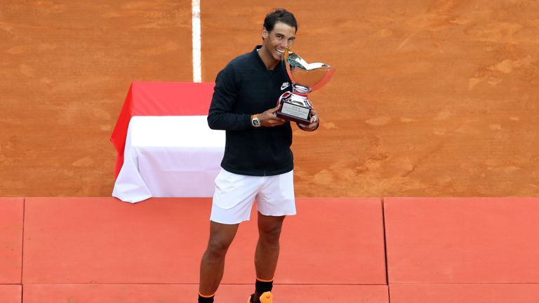 Spain's Rafael Nadal celebrates and bites the trophy during the prize ceremony after winning the Monte-Carlo ATP Masters Series Tournament final tennis mat