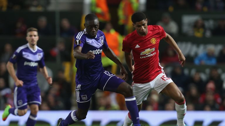 Wayne Rooney of Manchester United in action with Alexandru Chipciu of RSC Anderlecht during the UEFA Europa League quarter final