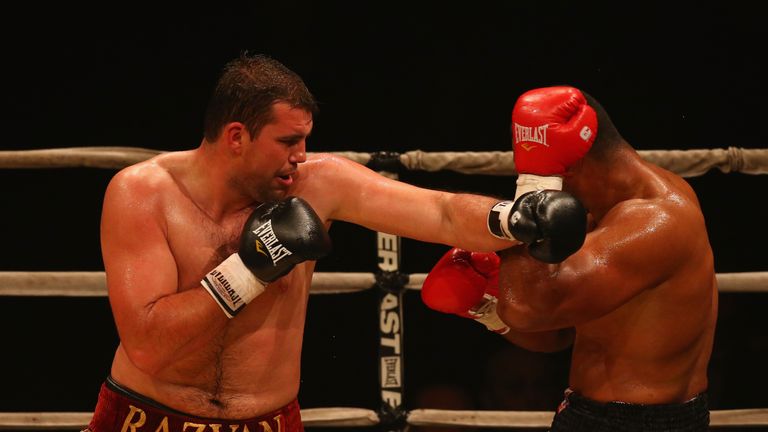 Razvan Cojanu of Romania (left) fights Paula Mataele of New Zealand