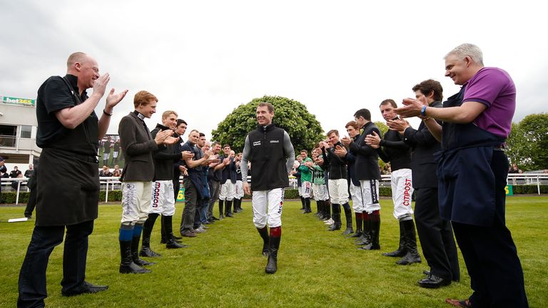 A guard of honour is formed for Richard Johnson as he is crowned Champion Jumps Jockey for the second time.