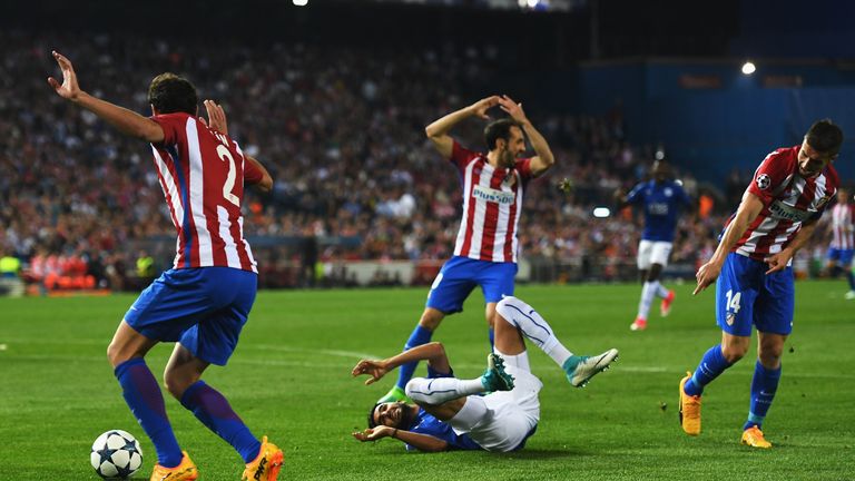  Riyad Mahrez of Leicester City goes to ground after a challenge by Gabi (R) of Atletico Madrid