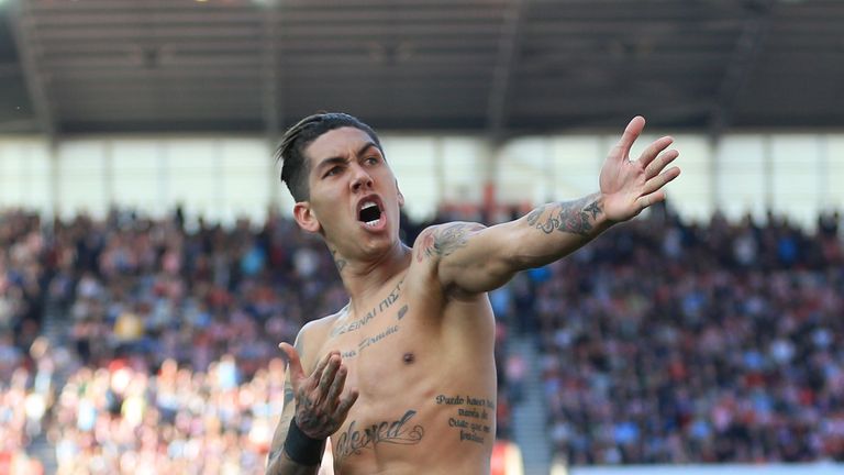 Liverpool's Roberto Firmino celebrates scoring his side's second goal of the game during the Premier League match at the bet365 Stadium, Stoke.