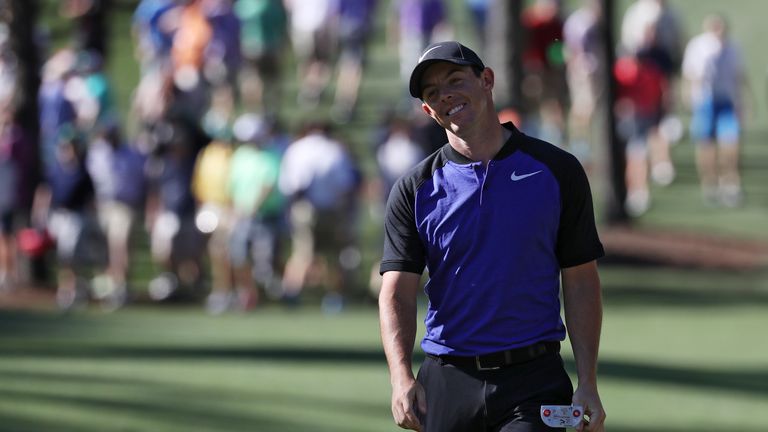 Rory McIlroy of Northern Ireland reacts to his putt on the sixth hole during a practice round prior to the start of the 2017 Masters