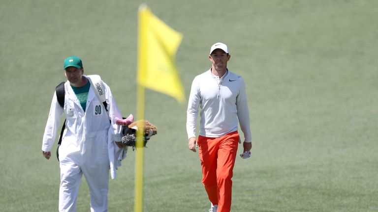 Rory McIlroy walks to the second green on day three