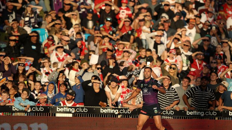 Cameron Smith and Dragons supporters watch on as the Storm hooker's touchline conversion sails between the posts