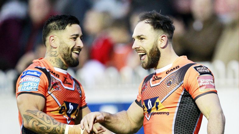 Luke Gale (right) is congratulated by Rangi Chase after scoring a try against Wigan