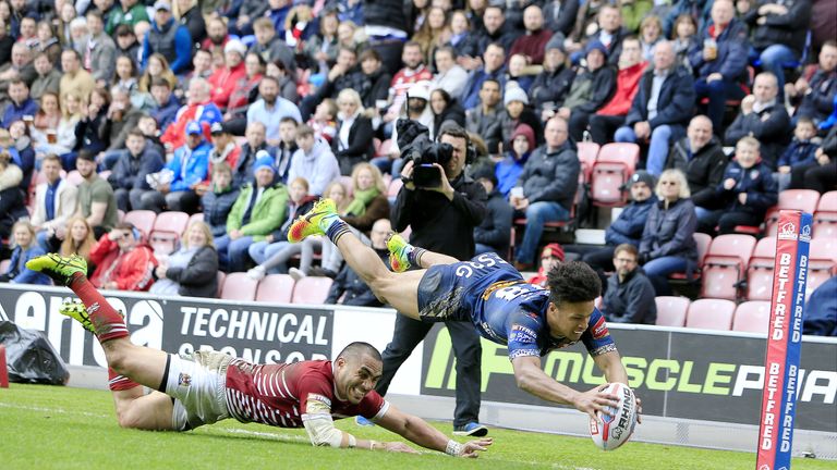 Tommy Leuluai is unable to prevent Regan Grace from scoring a try