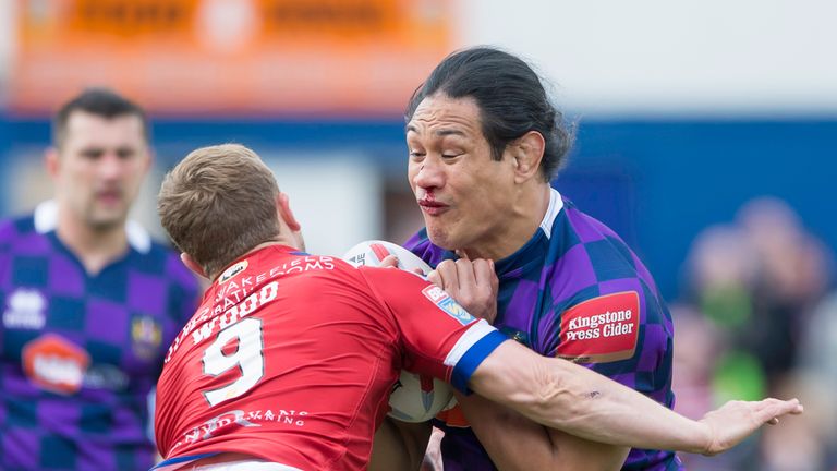 Taulima Tautai is tackled by Wakefield's Kyle Wood