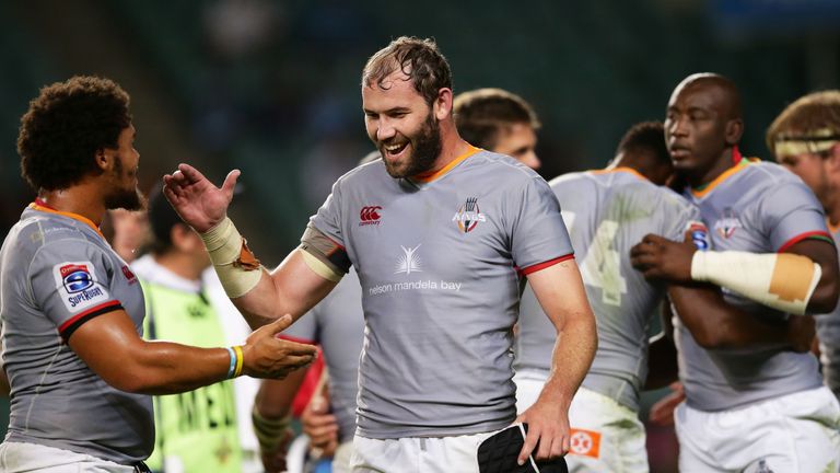 Wilhelm van der Sluys (centre) celebrates with Dayan van der Westhuizen after the final whistle