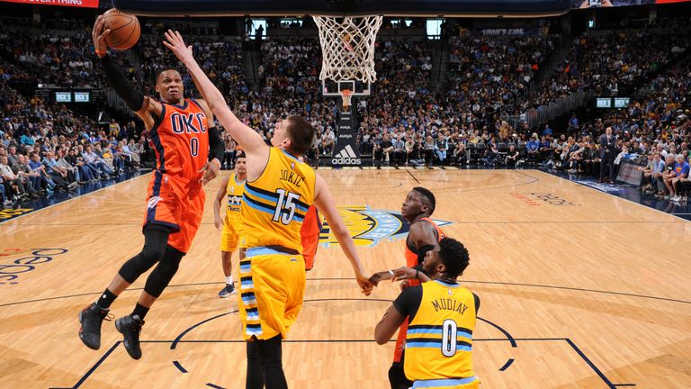 DENVER, CO - APRIL 9:  Russell Westbrook #0 of the Oklahoma City Thunder goes to the basket against the Denver Nuggets