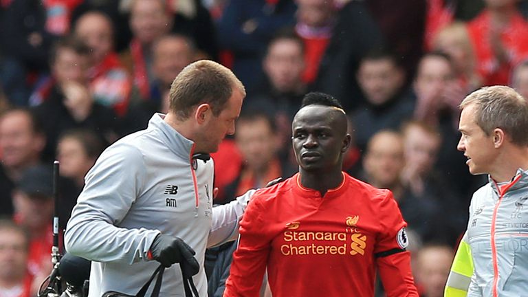 Liverpool's Sadio Mane leaves the pitch after picking up an injury during the Merseyside derby