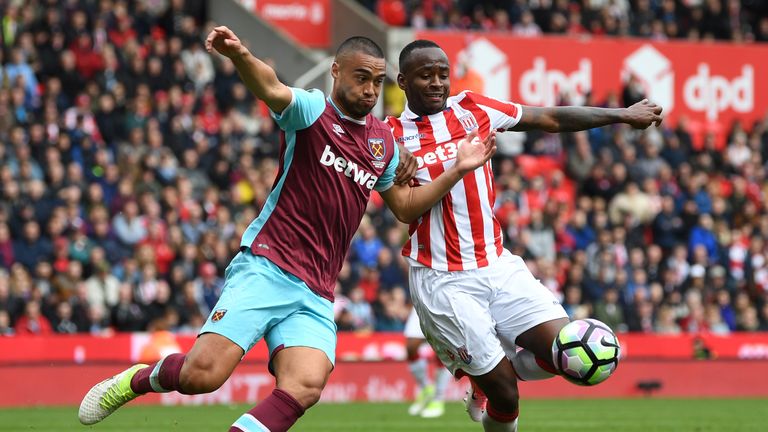 STOKE ON TRENT, ENGLAND - APRIL 29: Saido Berahino of Stoke City and Winston Reid of West Ham United clash  during the Premier League match between Stoke C
