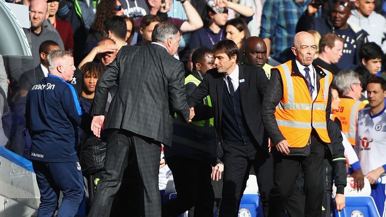 Sam Allardyce, Manager of Crystal Palace (L) and Antonio Conte, Manager of Chelsea (R) shake hands after the Premier League match at Stamford Bridge