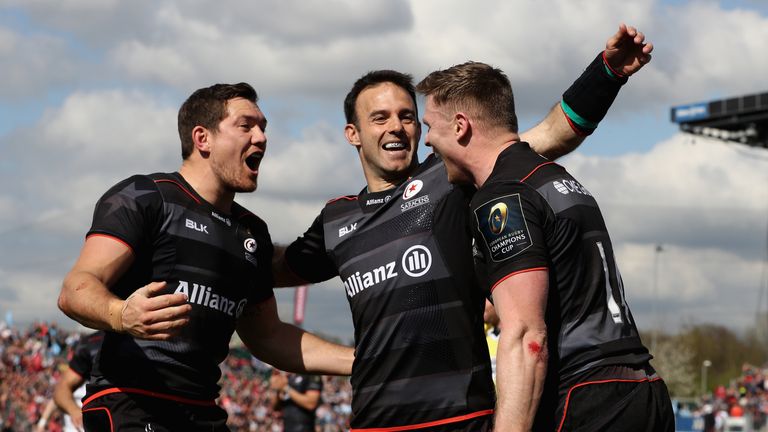  Chris Ashton of Saracens is congratulated by team mates Alex Goode  (L) and Neil de Kock after scoring his second try 