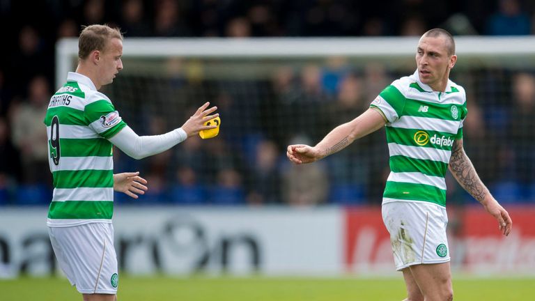 Celtic's Scott Brown hand the captain's armband to teammate Leigh Griffiths