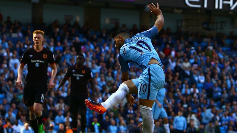Sergio Aguero scores his team's second goal during the English Premier League football match between Manchester City and Hull City at the Etihad Stadium