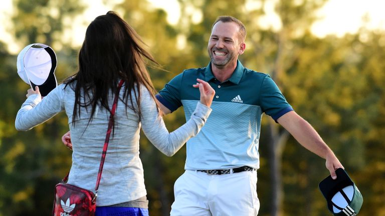 AUGUSTA, GA - APRIL 09:  Sergio Garcia of Spain embraces fiancee Angela Akins in celebration after defeating Justin Rose (not pictured) of England on the f