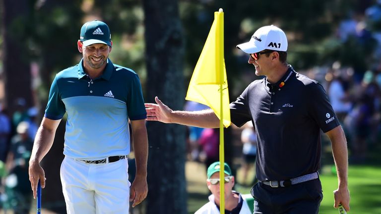 Sergio Garcia and Justin Rose share a laugh on the seventh green