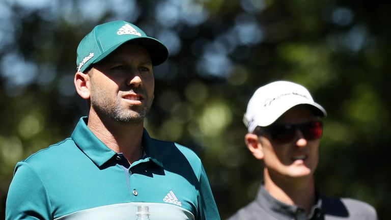 Sergio Garcia and Justin Rose look on during the fourth round of the Masters