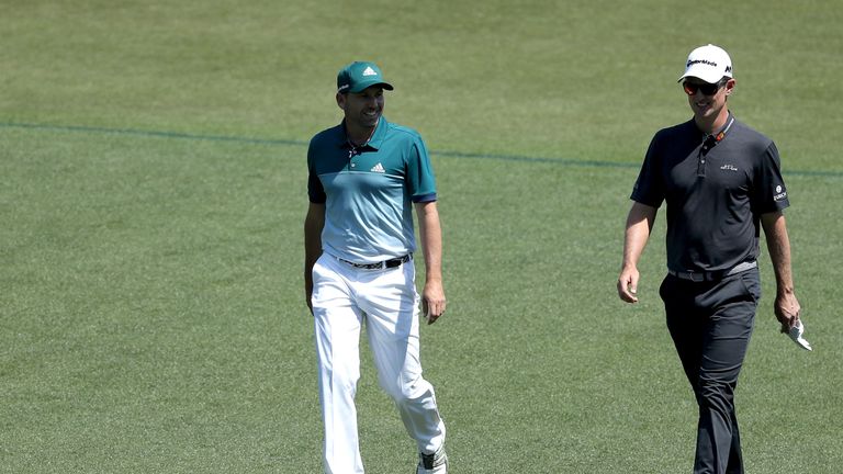 Sergio Garcia and Justin Rose of head down the first fairway during the final round of the 2017 Masters 