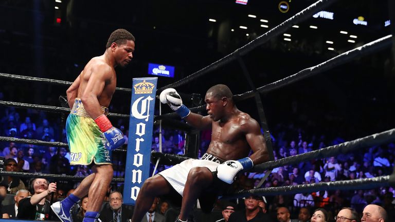 Shawn Porter knocks down Andre Berto in the ninth round during their WBC welterweight eliminator bout at the Barclays Center on A
