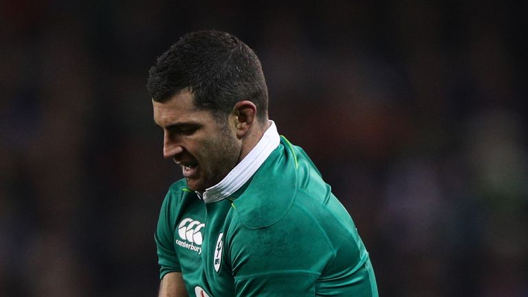 Rob Kearney holds his arm after tackling France's Gael Fickou