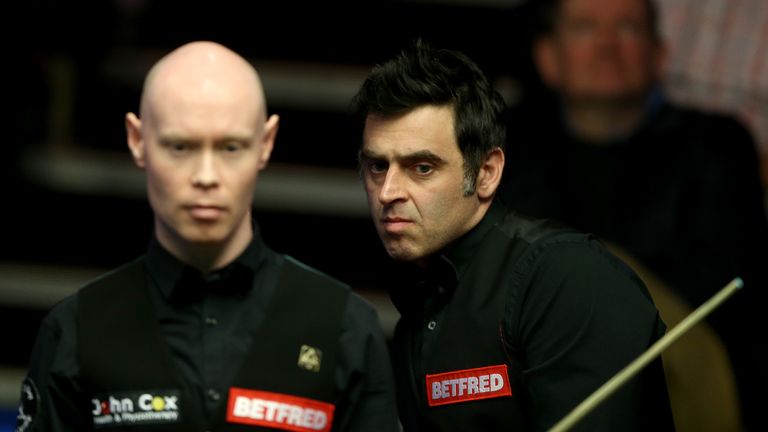 Ronnie O'Sullivan (R) and Gary Wilson during their first round match on day one of the World Championships