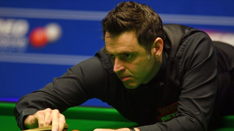 Ronnie O'Sullivan plays a shot during the World Championship Snooker quarter-final against China's Ding Junhui at The Crucible