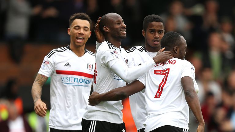 Sone Aluko celebrates with his Fulham team-mates after scoring a third at Craven Cottage