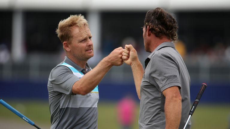 AVONDALE, LA - APRIL 28:  Soren Kjeldsen of denmark and Alex Cejka of Germany react after putting on the 18th green during the second round of the Zurich C