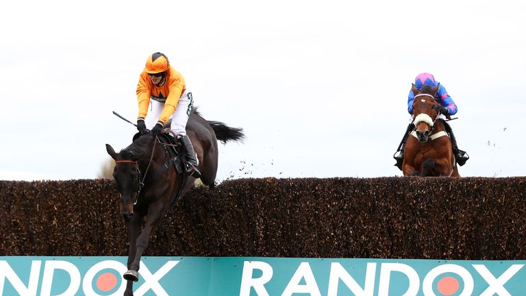 Tea for Two ridden by Lizzie Kelly (L) passes Cue Card 