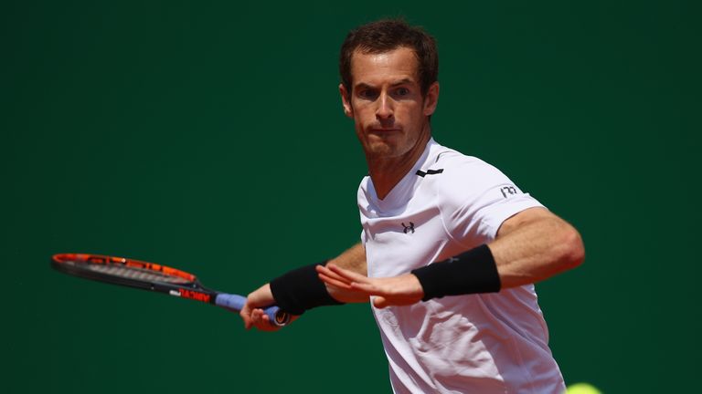 Andy Murray of Great Britain plays a forehand against Gilles Muller of Luxembourg