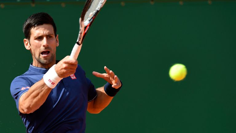 Serbia's Novak Djokovic hits a return to French's Gilles Simon during the Monte-Carlo ATP Masters Series tournament