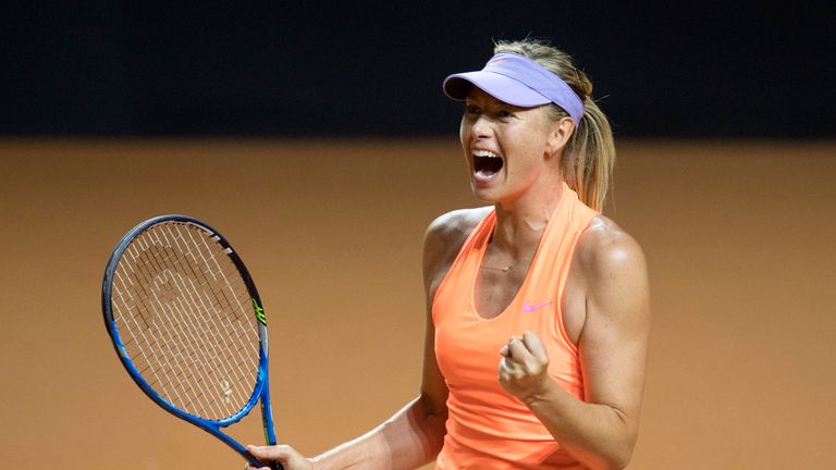 Russia's Maria Sharapova celebrates after she defeated Russia's Ekaterina Makarova in their second round match at the WTA Porsche Tennis Grand Prix