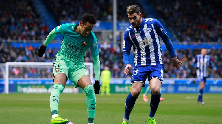  Neymar JR. (L) of FC Barcelona competes for the ball with Theo Hernandez (R) of Deportivo Alaves 