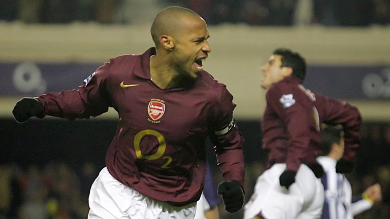 London, UNITED KINGDOM:  Two goal scorer Frenchman Thierry Henry (L) of Arsenal celebrates a goal against Portsmouth during a premiership match at Highbury