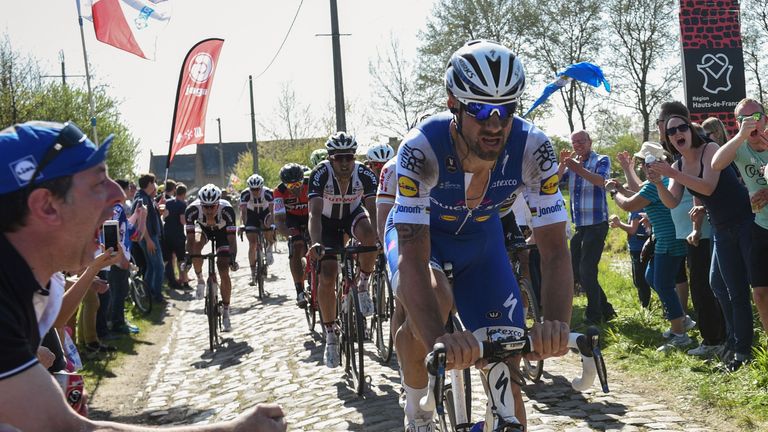 Belgium's Tom Boonen (front) rides on the cobblestones during the 115th edition of the Paris-Roubaix one-day classic cycling race, between Compiegne and Ro
