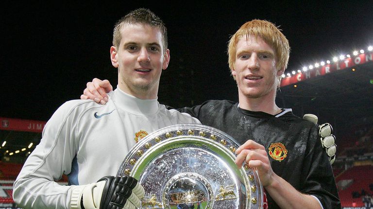 LONDON, ENGLAND - MAY 12: Tom Heaton and Paul McShane of Manchester United pose with the trophy after 