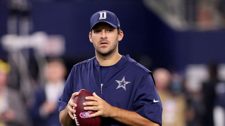 Injured Tony Romo #9 of the Dallas Cowboys throws prior to a game against the Chicago Bears at AT&T Stadium