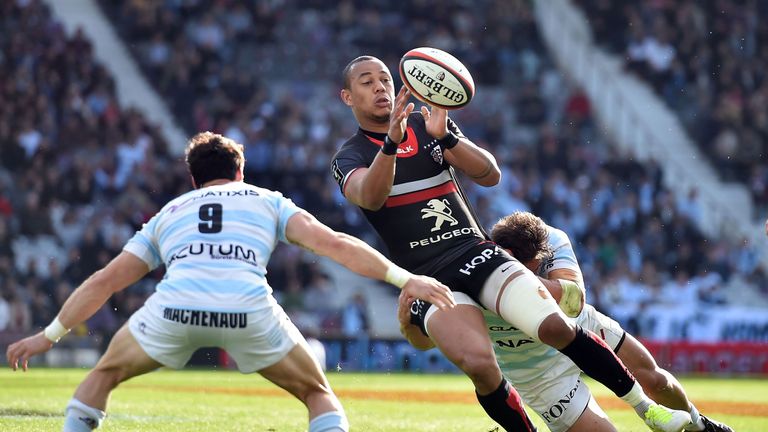 Toulouse's center Gael Fickou (C) holds the ball during the French Top 14 rugby union match between Stade Toulousain and Racing 92 on April 16, 2017 at the