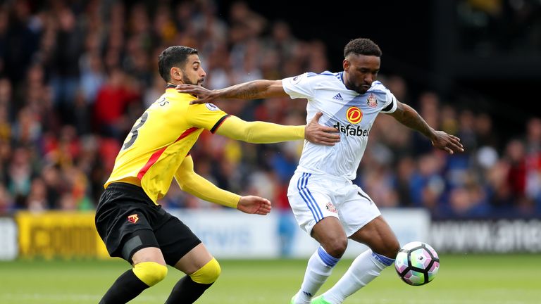 Miguel Britos of Watford puts pressure on Jermain Defoe of Sunderland