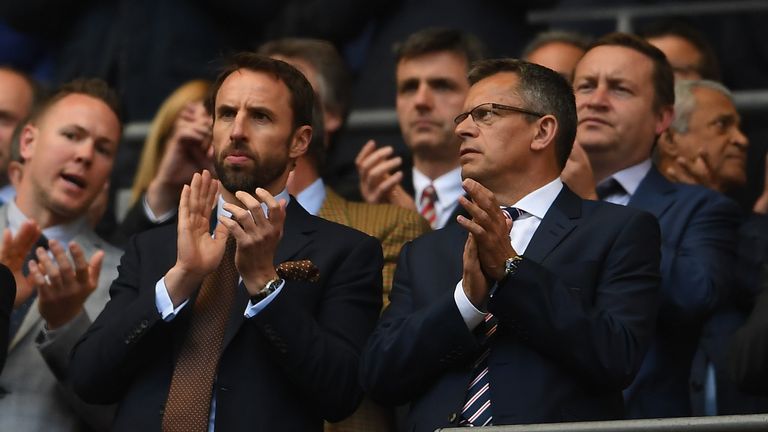 LONDON, ENGLAND - APRIL 22:  England manager Gareth Southgate takes part in a minute's applause for Ugo Ehiogu with FA Chief Executive Martin Glenn during 