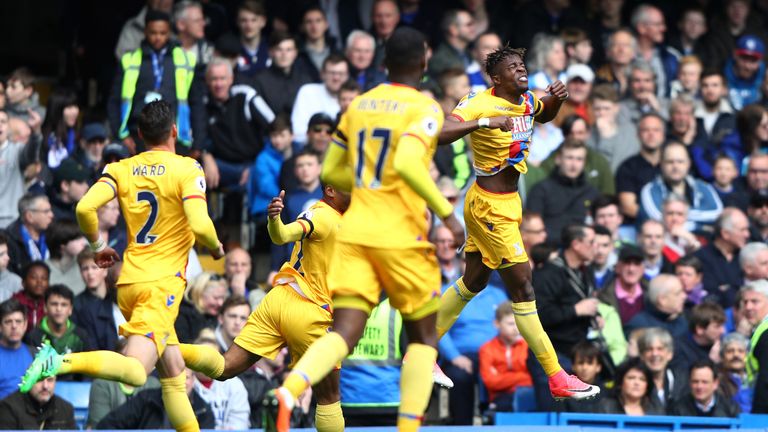 Wilfried Zaha of Crystal Palace (R) celebrates scoring his side's first goal during the Premier League match v Chelsea