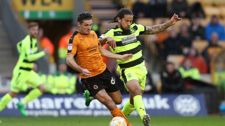 Wolverhampton Wanderers Andi Weimann is challenged by Huddersfield Town's Sean Scannell during the Sky Bet Championship match at Molineux Stadium, Wolverha