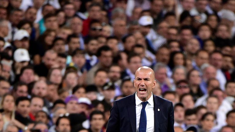 Real Madrid's French coach Zinedine Zidane shouts on the sideline during the Spanish league Clasico football match Real Madrid CF vs FC Barcelona at the Sa